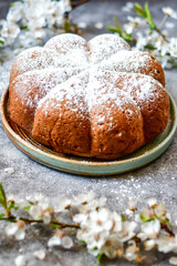 Homemade  Italian style  Easter  bread cake, spring blossom  and  hand colored eggs. Homemade pastry.  Easter holiday baking and decorarion