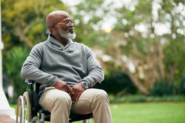 Taking in the views. Cropped shot of a handsome senior man sitting in his wheelchair outside. - Powered by Adobe