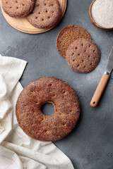 Reikäleipä - traditional finnish rye bread on a gray concrete background