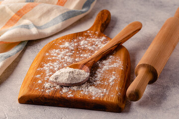 Ingredients for baking - flour, spoon, rolling pin.
