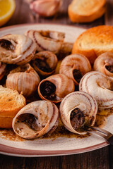 snails with butter on a plate