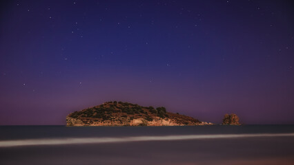 sea rock under starry night Gargano Italy