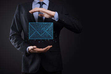 Businessman hand holding letter icon,email icons.Contact us by newsletter email and protect your personal information from spam mail.Customer service call center contact us.Email marketing newsletter.