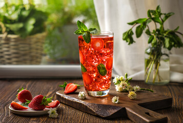Strawberry lemonade with mint. Iced tea with strawberries. Summer refreshing cocktail with ice.
