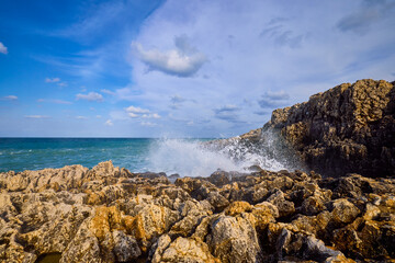 Beautiful landscape with a rocky sea shore on a sunny day