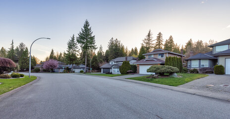 Fraser Heights, Surrey, Greater Vancouver, BC, Canada. Street view in the Residential Neighborhood during a colorful spring season. Colorful Sunset Sky.
