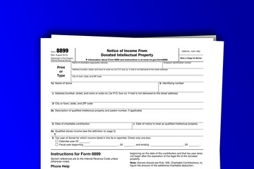 Form 8899 documentation published IRS USA 09.20.2013. American tax document on colored