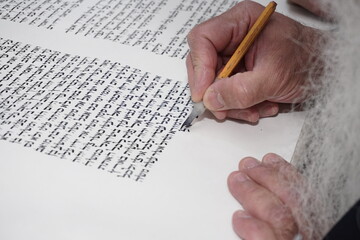 Sofer writes a sefer Torah
