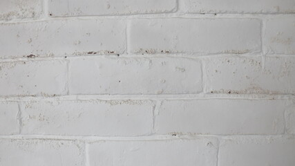 Pared blanca de ladrillos pintado, textura rustica