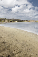 Walk along the salty shores of the Jan Thiel lagoon on the Caribbean island Curacao