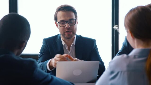 Young businessman in a suit interviewing a people in the office