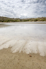 Walk along the salty shores of the Jan Thiel lagoon on the Caribbean island Curacao