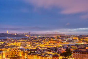 Fototapeta na wymiar View over downtown Lisbon with the Christ Statue and the 25 de Abril bridge at night