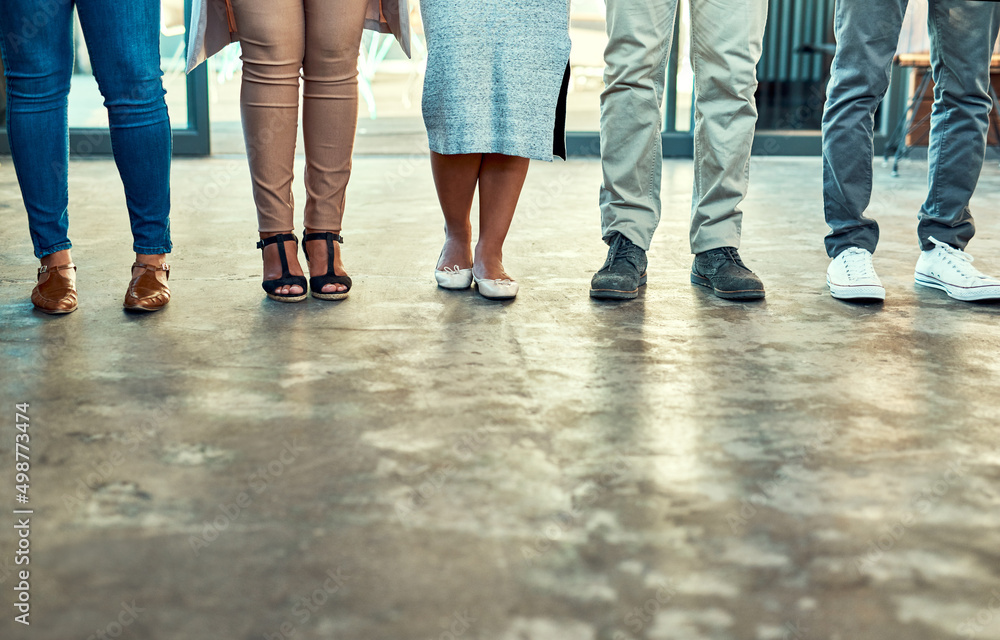Aufkleber theres no issue when you have nice shoes. low angle shot of a group of unrecognizable work colleague