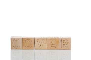 Naklejka premium Wooden cubes with letters cover on a white background
