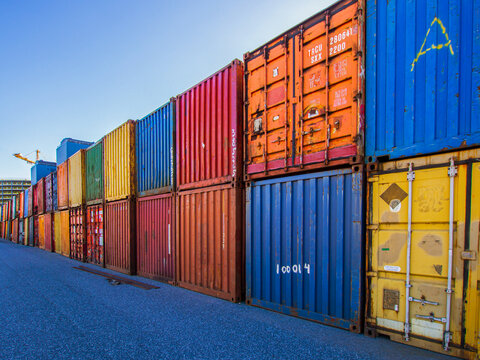 Row of stacked multicovered shipping containers