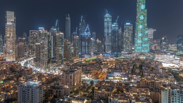 Dubai Downtown night timelapse with tallest skyscraper and other towers