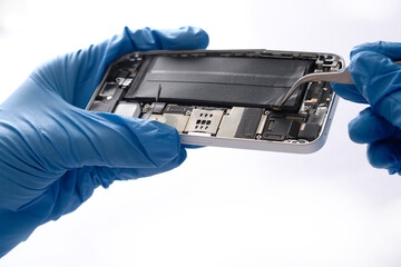 Technician repairing the Cell phone parts and tools for recovery repair phone smartphone and...