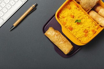 Homemade Couscous in a lunch box with vegetables