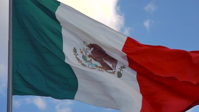 Big Mexican Flag Floating on the wind in slow motion. Close up.