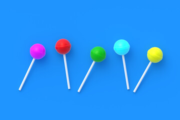 Colorful lollipops on stick on blue background. Sweet candy. Confectionery goods. Flat lay. 3d render