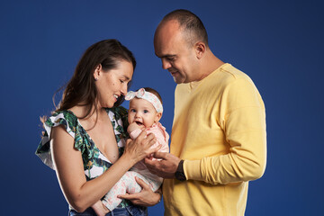 Happy family with baby daughter