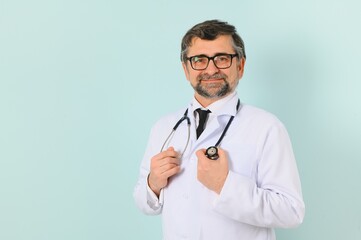 Senior doctor man wearing stethoscope and medical coat oveer blue background