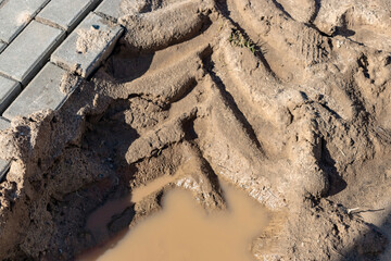 The footpath collapsed. hole in pedestrian sidewalk area. Crashed hole in cobblestone on city sreet. The collapse of paving slabs.