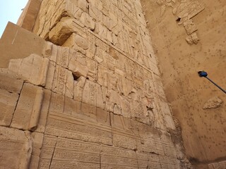 Carvings and hieroglyphics on the exterior wall, at the Karnak Temple Complex in Luxor, Egypt.