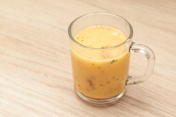 cup of hot soup on the table