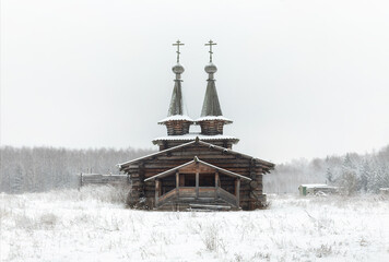 Wooden Orthodox church in winter in the countryside
