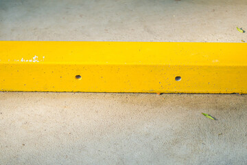 Abstract background horizontal yellow cement bar with concreate floor texture