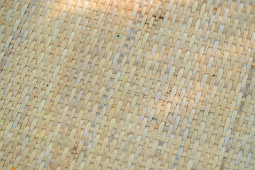 Abstract light brown handmade bamboo or wicker weave mat pattern for gradient texture and background