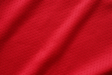 Fototapeta na wymiar Red sports clothing fabric football shirt jersey texture close up