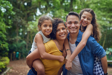 Mom, dad and their two little angels. Cropped portrait of a happy family spending some time together at the park.