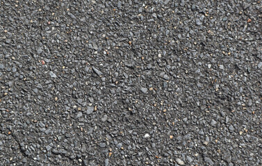 Gray dry urban asphalt, road surface, with coarse granules