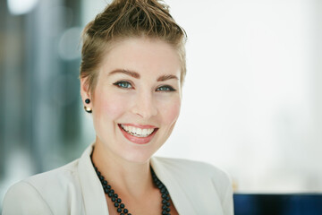 My passion lies in building my business further. Portrait of a young businesswoman sitting in an office.