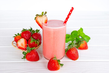 Strawberry yogurt fruit juice smoothie pink colorful fruit juice milkshake blend beverage healthy high protein the taste yummy In glass drink episode morning on white wood background.