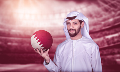 Arab man holding Qatar soccer ball welcoming countries for football world cup.