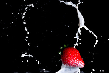 Obraz na płótnie Canvas Fruit in milk. Levitation, splashes, black background, isolate.