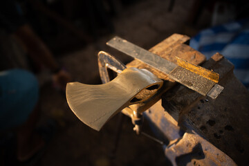 process with axe making by blacksmith