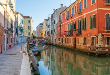 Morning in Venice, water channels along residential buildings, cityscape