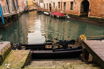 docked gondola by the canal in Venice, Italy © gammaphotostudio