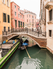boat on canal and architecture in Venice, Italy 