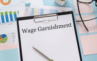 Paper with Wage Garnishment on a table.