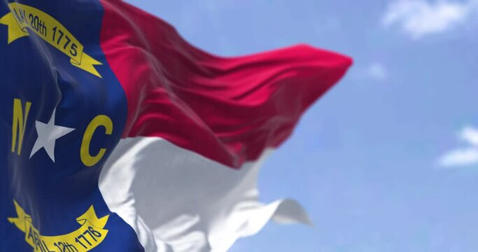 The US state flag of North Carolina waving in the wind