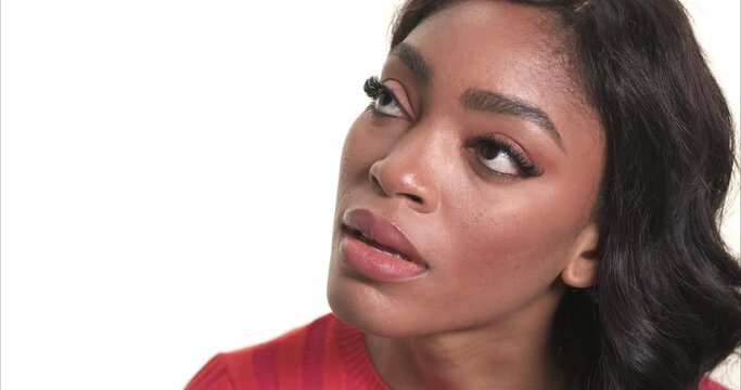 Black Woman Face Looking Up Solemnly. Isolated On A White Background. Hope Concept.