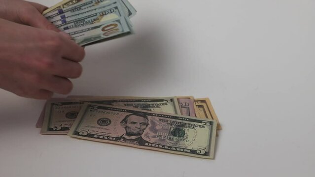 Hands counting dollar paper currency, banknotes of USA.