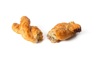Braided bun broken in half, made of puff pastry with minced meat