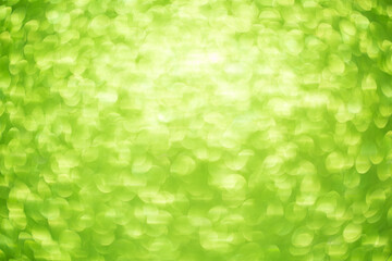 Green bokeh background. Festive Christmas shiny background. Glittering green light.